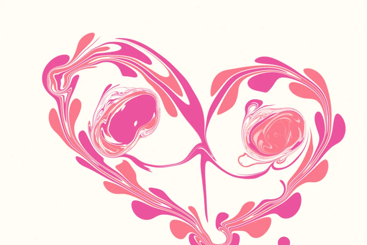 Ein großes Herz aus pinken und rosa Ebru-Tropfen, innen zwei kleine Wirbel